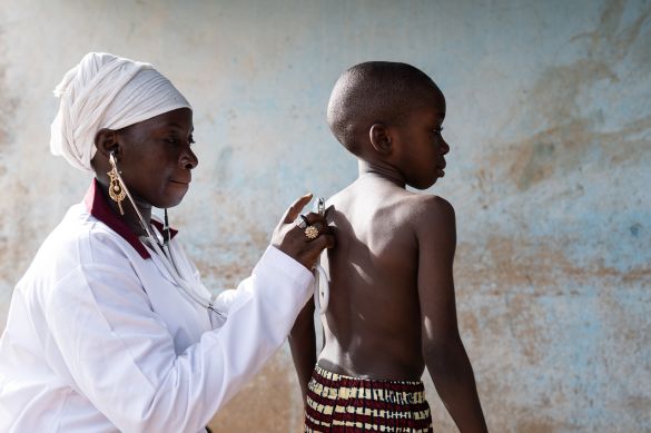 Female doctor with young boy patient