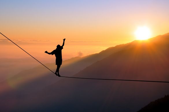 Man walking on a tightrope